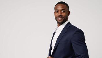 Stylish studio portrait showcases an attractive selfassured Black male model against a pristine white background photo