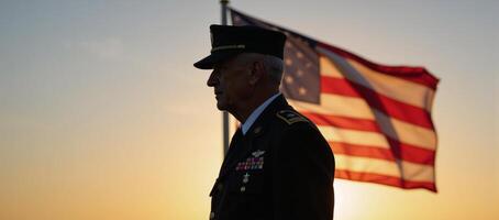 An old veteran silhouetted against the setting sun depicted on the U photo