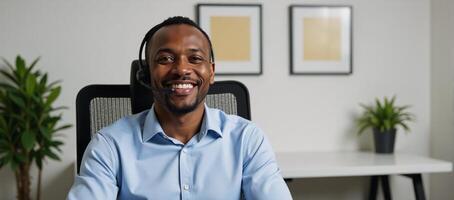 An office setting featuring an African American man with headset and smiling expression photo