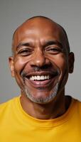 Middleaged African American man featuring a joyful expression on his face photo