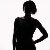 AfricanAmerican woman portrayed as a stylized silhouette on a white studio backdrop photo