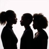 Profile silhouettes depict diverse Black female empowerment through racial equality in a strong sisterhood photo
