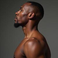 Detailed anatomical study depicts sideview profile of muscular African American man with accentuated veins photo