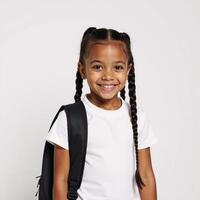 Adorable black child in backpack posed against white background for backtoschool theme photo