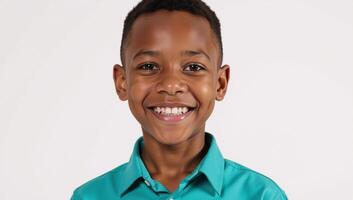 Portrait of a happy African American youth with teal clothing on a white backdrop photo