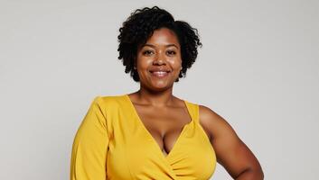 A stylish plussize woman with an afro flaunts trendy jumpsuit in art photo