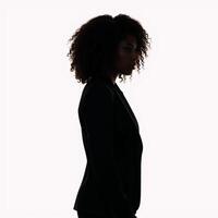 Profile portrait featuring a confident black woman with curly hair isolated against white background photo