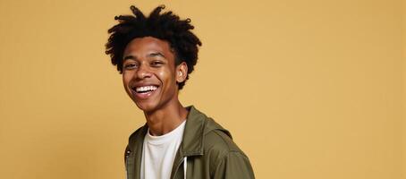 Isolated on a beige backdrop a happy Gen Z guy is captured midwink in playful style showcasing his cool ethnic features and perfectly aligned teeth photo