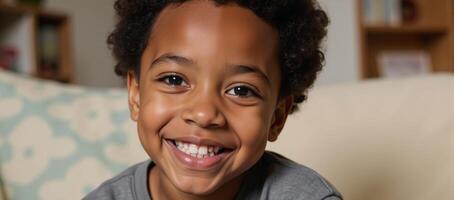 Closeup portrait of a happy African American boy radiating childlike charm in an inviting interior setting photo