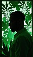 AfricanAmerican man profile with tropical plants in papercut style showcasing an interplay between human and nature rendered primarily in shades of green photo