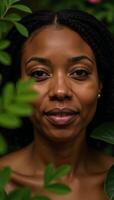Serene African American woman amidst lush foliage conveying inner peace and natures embrace photo