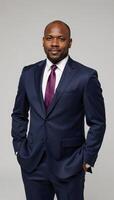 A confident AfricanAmerican male executive excels within a professional setting photo