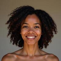 Confident pose by a beautiful African American woman with vibrant curls bright smile and soft natural lighting against a neutral backdrop photo