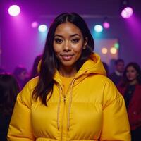 African American hiphop fashion diva posing confidently in purple club light with a yellow puffer jacket and hoodie in portrait style photo