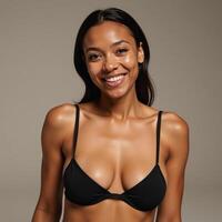 AfricanAmerican woman smiling in simple black bikini captured by soft natural light photo
