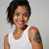 Portrait showcases smiling Generation Z African American woman with tattoos on skin photo