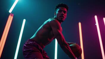 A handsome black basketball player showcasing skill with dynamic motion under neon lights for wallpapers with highdefinition backgrounds photo