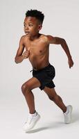 Image of an isolated African American boy running against a white background photo
