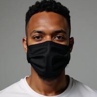 An AfricanAmerican man wearing a face mask due to COVID photo