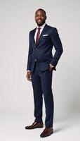 Isolated leadership portrait showcasing a confident senior African American businessman in a suit against a plain white backdrop photo
