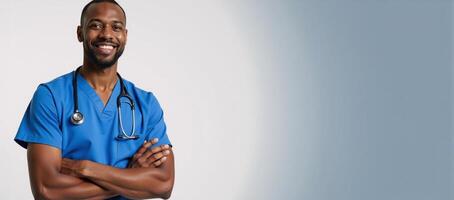 A friendly AfricanAmerican male nurse stands confidently in his blue scrubs smiling warmly while holding a stethoscope embodying caring and compassion photo