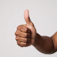 Isolated thumbup image featuring a smiling Black American hand photo