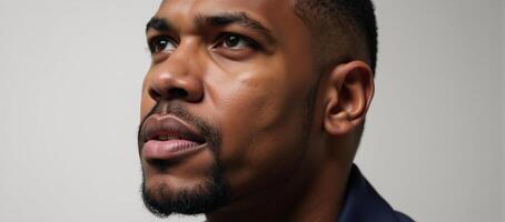 Closeup portrait showcasing an introspective African American male photo