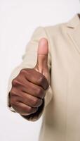 Isolated thumbup image featuring a smiling Black American hand photo