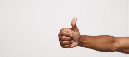 Isolated thumbup image featuring a smiling Black American hand photo