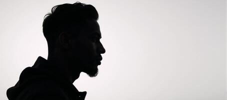 Black man silhouette captivating portrait of young AfricanAmerican male photo