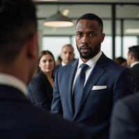 Intense corporate meeting featuring a determined focused African American man in business attire amidst a busy office backdrop photo
