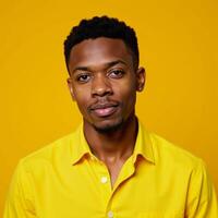 A lively image featuring a youthful African American man in a bright yellow top photo