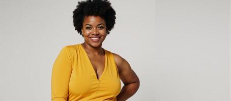 A stylish plussize woman with an afro flaunts trendy jumpsuit in art photo