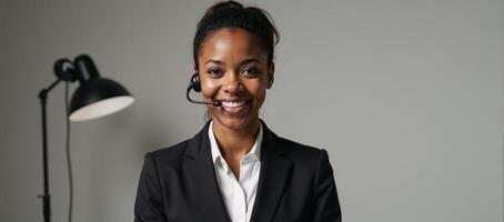 A focused African American woman at a call center with simple clean backdrop ideal for added textbranding photo