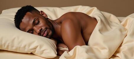 AfricanAmerican man lying on fabric bed photo