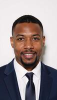 Portrait of an AfricanAmerican male against white backdrop suitable for ID photo