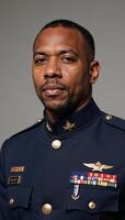 Angled view portrait of a determined AfricanAmerican solider in military uniform photo