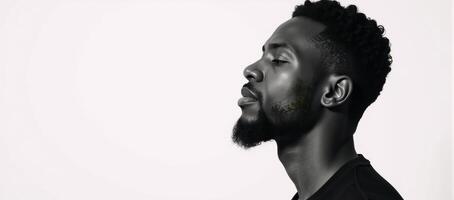 A blackandwhite double exposure portrait showcases a serene African American man sitting within a forest backdrop against a stark white background his closed eyes convey an air of contemplative peace photo