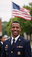 Joyful AfricanAmerican soldier smiling against a blurred American Flag backdrop photo