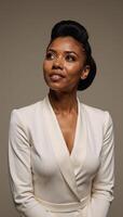 An Enchanting Portrait showcases a serene gaze from an African American woman looking upwards photo