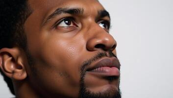 Closeup portrait showcasing an introspective African American male photo