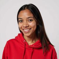 A striking portrait showcases an African American woman with red hoodie and smile set against a crisp white backdrop photo