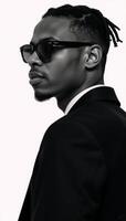 A young AfricanAmerican man wearing dreadlocks and sunglasses is depicted in profile view in a sleek modern art style on a minimalist allwhite backdrop photo