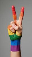 Painting depicting a clenched fist in rainbow colors to represent LGBTQ pride photo