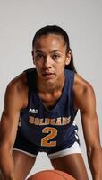 Closeup portrait of focused African American female basketball player with determination photo