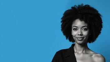 An African American woman with an Afro is depicted against a blue backdrop photo