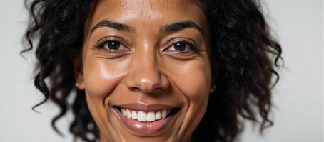 A beautiful closeup of a middleaged woman blackAfrican American aged 5060 captured in high detail in a unique 4K portrait photo