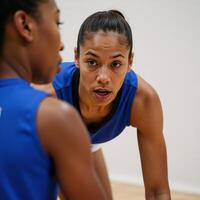 Closeup portrait of focused African American female basketball player with determination photo