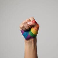 Painting depicting a clenched fist in rainbow colors to represent LGBTQ pride photo