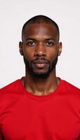 African American man in red tee isolated against white background photo
